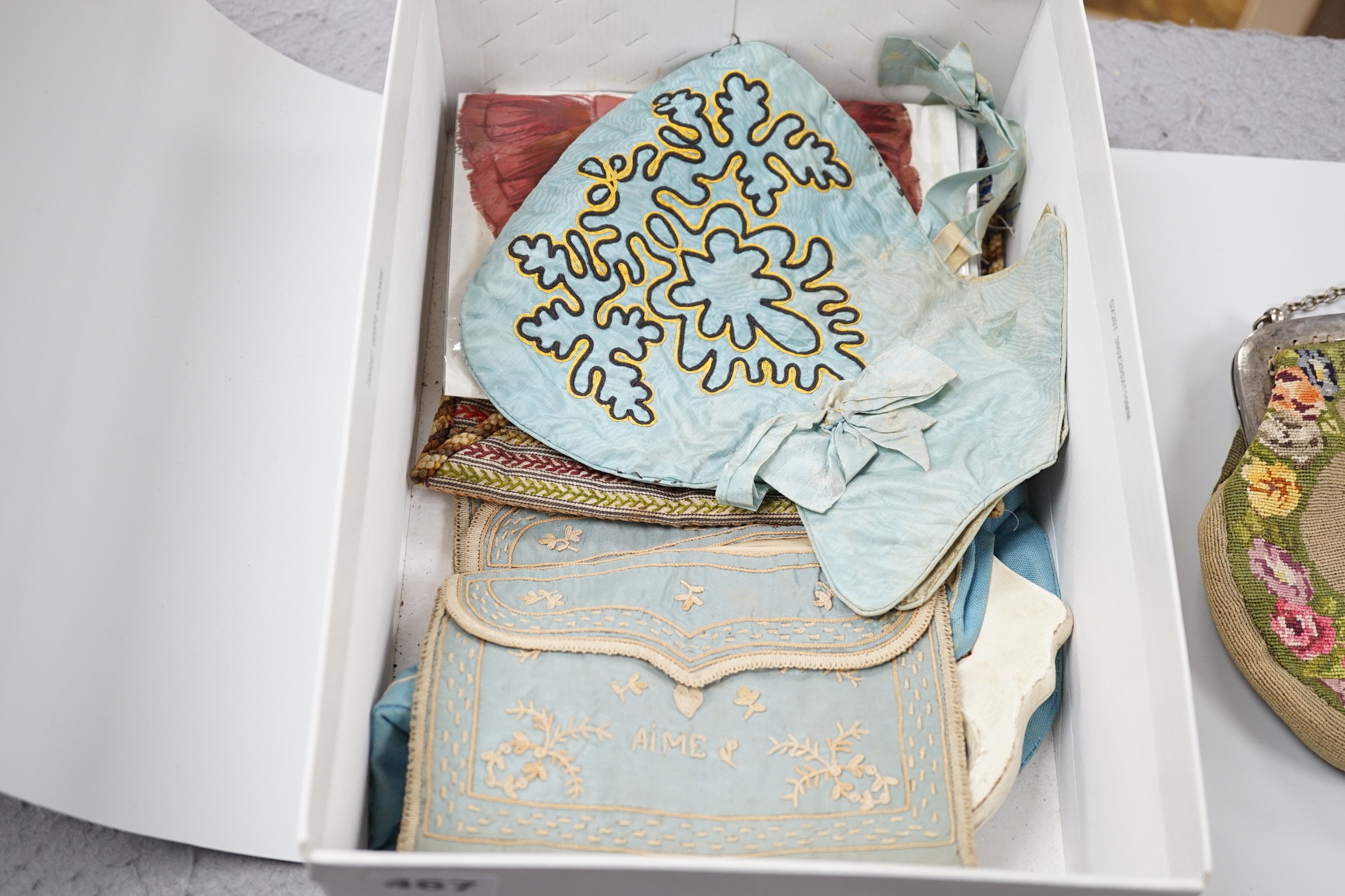 A collection of 19th and early 20th century crochet, embroidered and beaded reticules, evening bags and bible bags